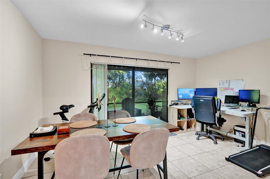 9851 Riverside Drive Coral Springs, FL 33071 - Photo 11 of 35 a view of a workspace with furniture and a window