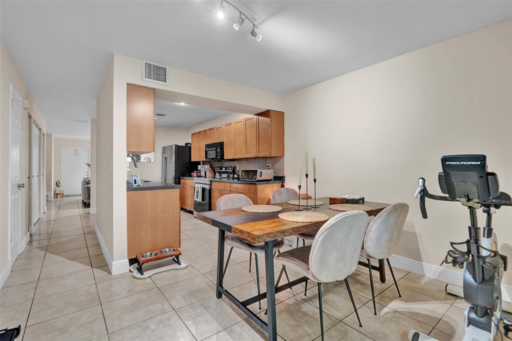9851 Riverside Drive Coral Springs, FL 33071 - Photo 13 of 35 a view of a dining room with furniture
