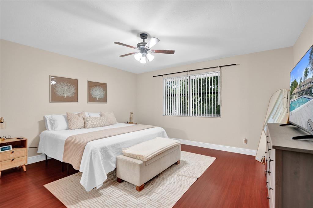 9851 Riverside Drive Coral Springs, FL 33071 - Photo 15 of 35 a spacious bedroom with a bed and a window