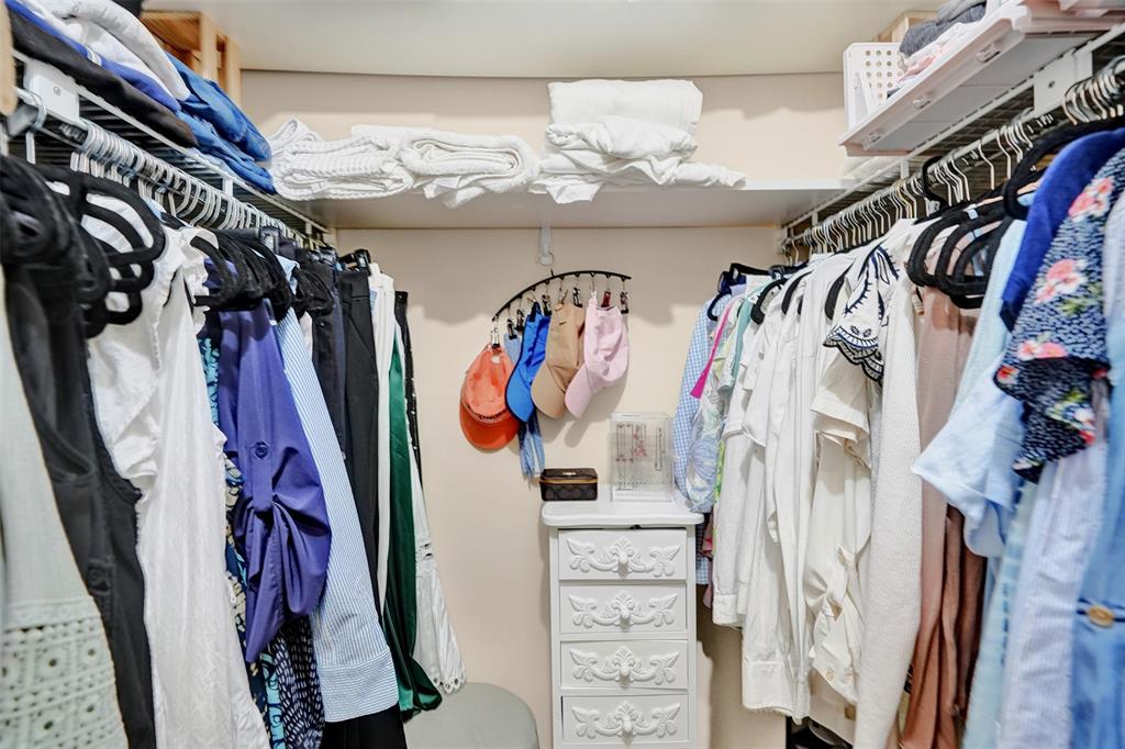 9851 Riverside Drive Coral Springs, FL 33071 - Photo 20 of 35 a view of walk in closet with clothes