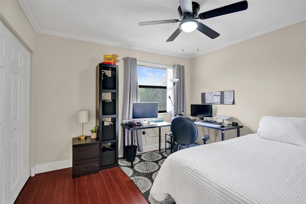 9851 Riverside Drive Coral Springs, FL 33071 - Photo 23 of 35 a room with two bed and a table