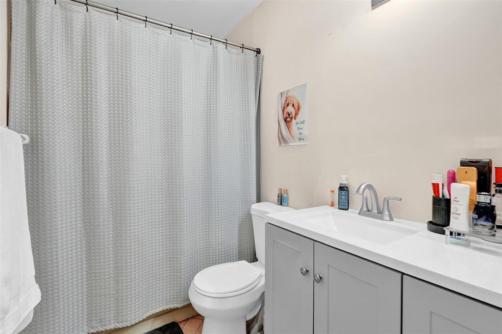 9851 Riverside Drive Coral Springs, FL 33071 - Photo 24 of 35 a bathroom with a sink and a toilet