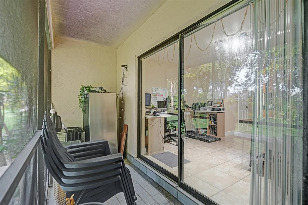 9851 Riverside Drive Coral Springs, FL 33071 - Photo 28 of 35 a bathroom with a glass door shower and a sink