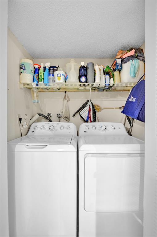 9851 Riverside Drive Coral Springs, FL 33071 - Photo 30 of 35 a utility room with dryer and washer