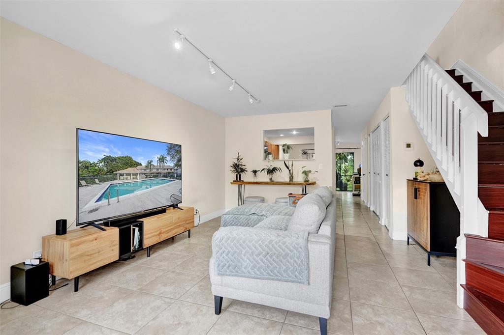 9851 Riverside Drive Coral Springs, FL 33071 - Photo 7 of 35 a living room with furniture and a flat screen tv
