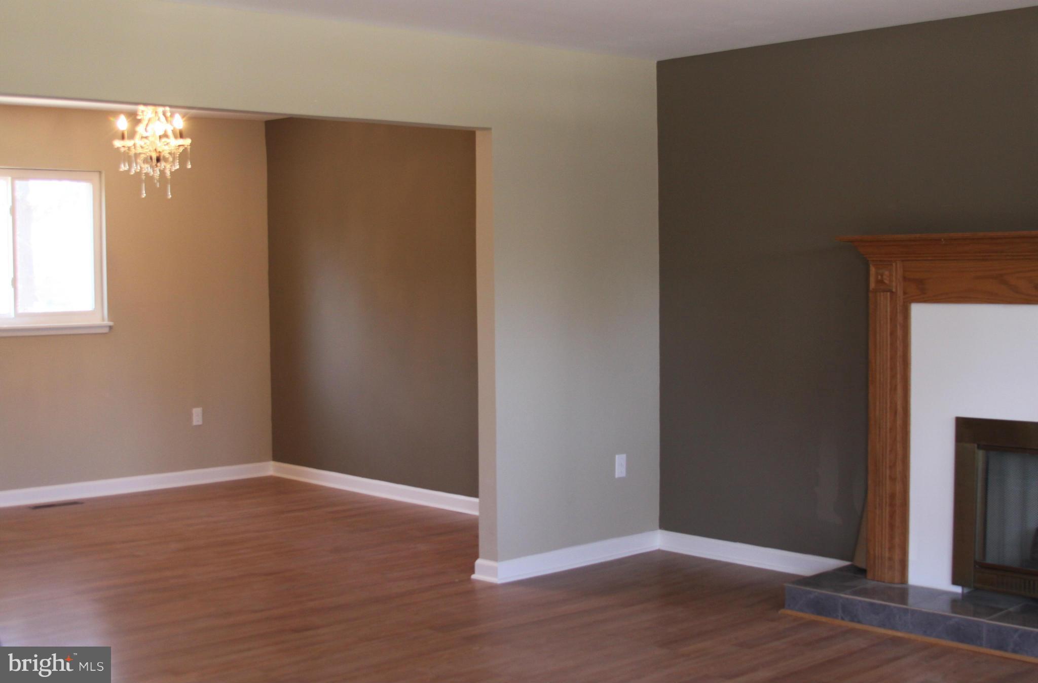 2016 Greengage Road Baltimore, MD 21244 - Photo 2 of 26 an empty room with wooden floor closet and windows