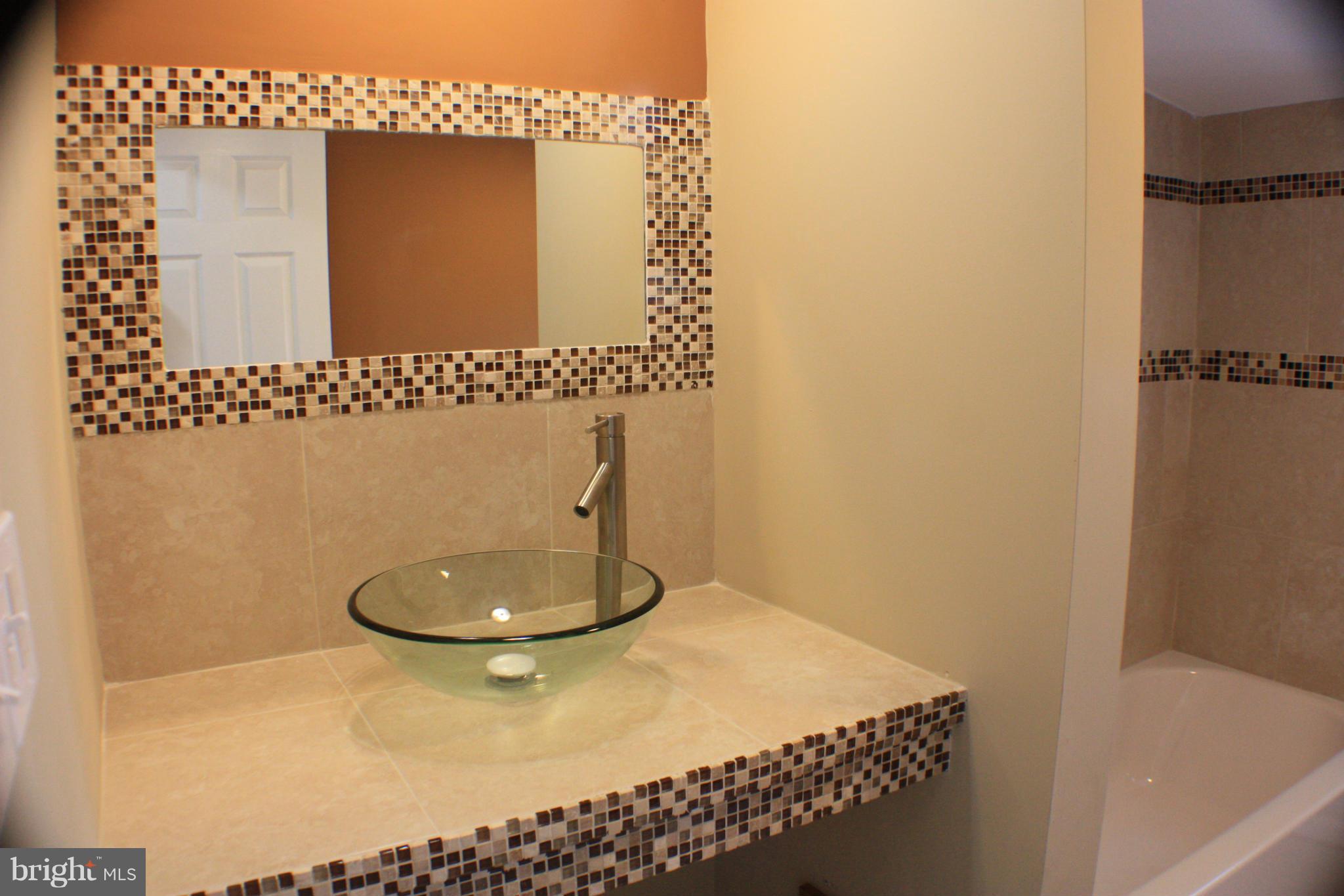 2016 Greengage Road Baltimore, MD 21244 - Photo 14 of 26 a bathroom with a toilet and a sink