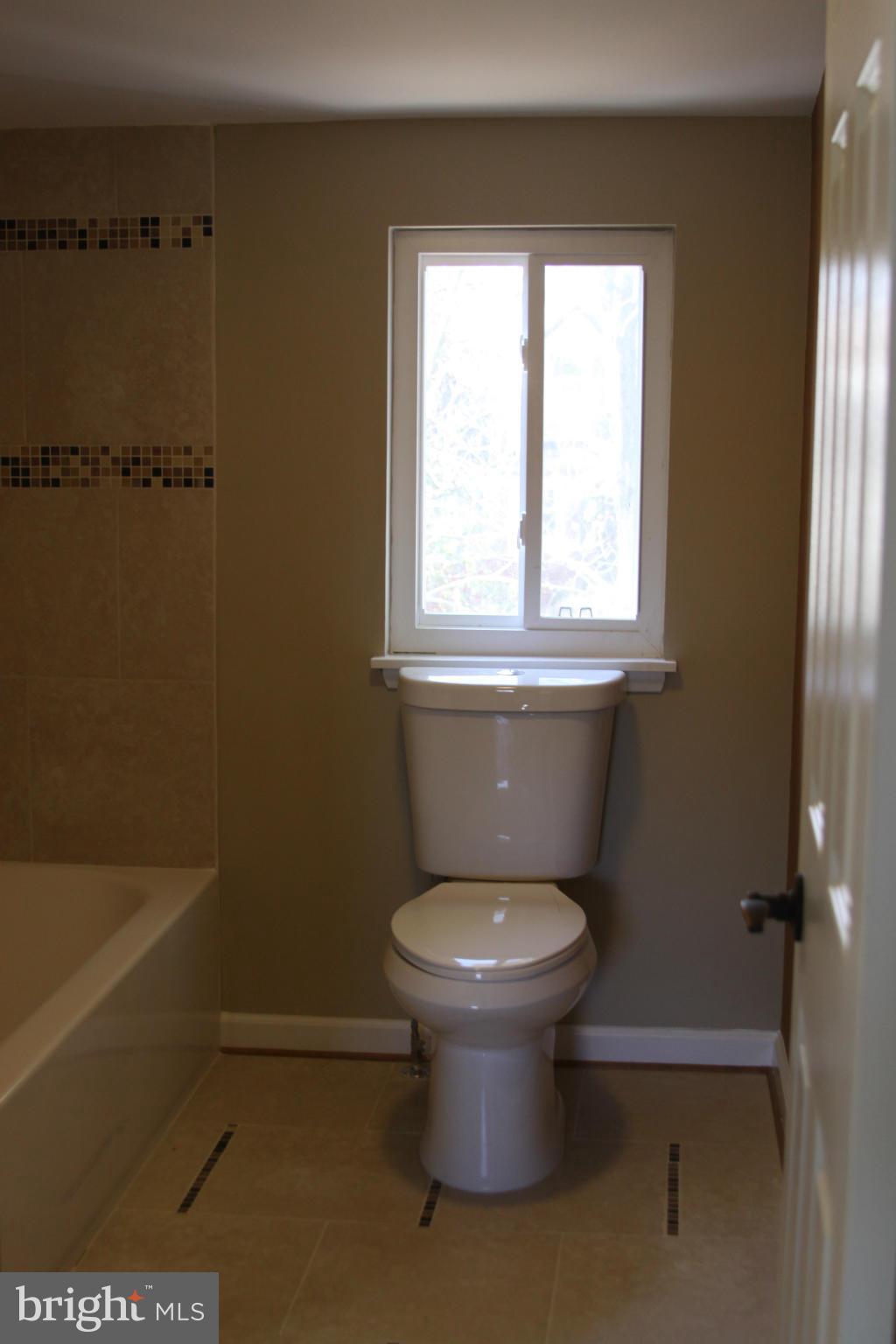 2016 Greengage Road Baltimore, MD 21244 - Photo 16 of 26 a bathroom with a toilet and a sink
