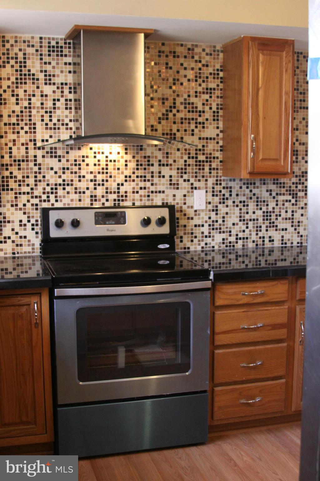2016 Greengage Road Baltimore, MD 21244 - Photo 6 of 26 a kitchen with granite countertop stainless steel appliances and cabinets