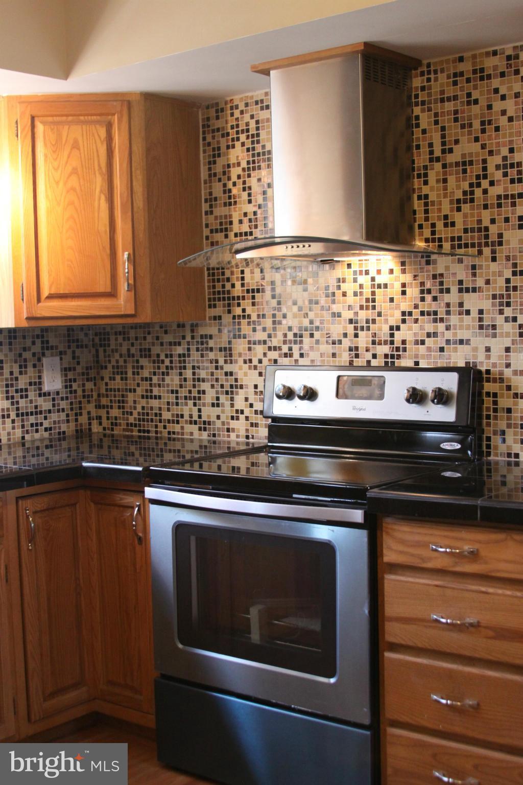 2016 Greengage Road Baltimore, MD 21244 - Photo 7 of 26 a kitchen with granite countertop cabinets and black stainless steel appliances