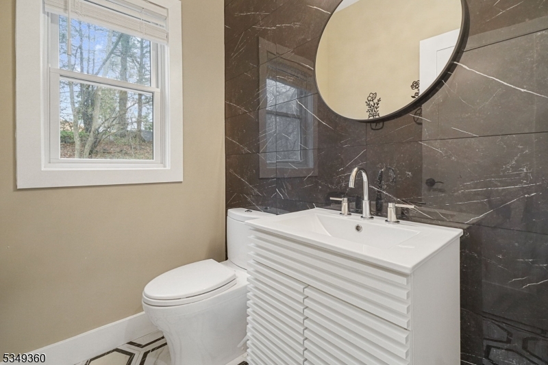 232 Kinnelon Road Kinnelon, NJ 07405 - Photo 12 of 43 a bathroom with a sink mirror and toilet