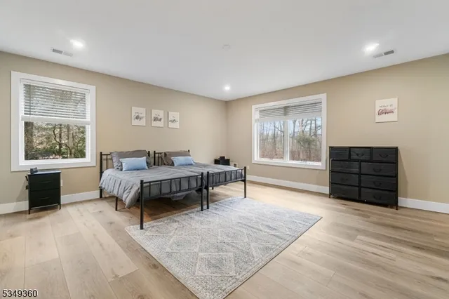 a bedroom with furniture and window
