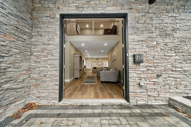 a view of a brick house with a porch