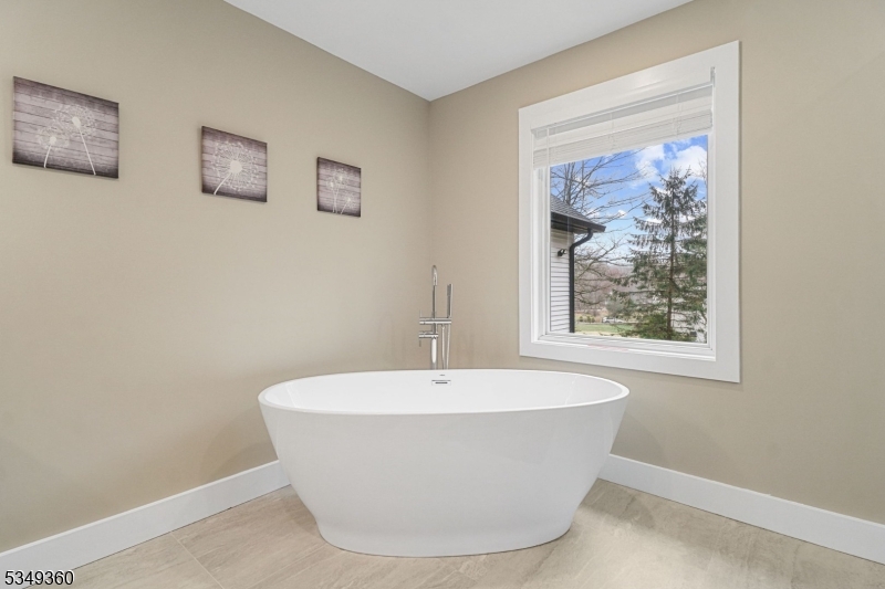 232 Kinnelon Road Kinnelon, NJ 07405 - Photo 31 of 43 a white bath tub sitting in a bathroom