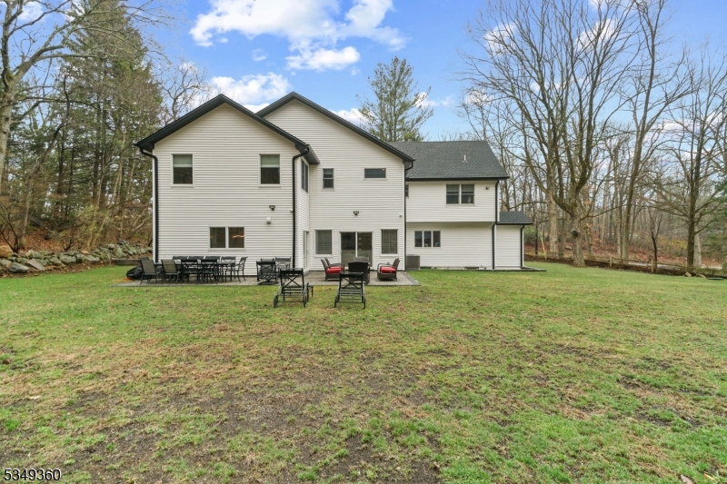 232 Kinnelon Road Kinnelon, NJ 07405 - Photo 40 of 43 a view of a house with a yard