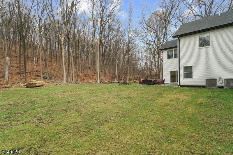 232 Kinnelon Road Kinnelon, NJ 07405 - Photo 41 of 43 a backyard of a house with lots of green space
