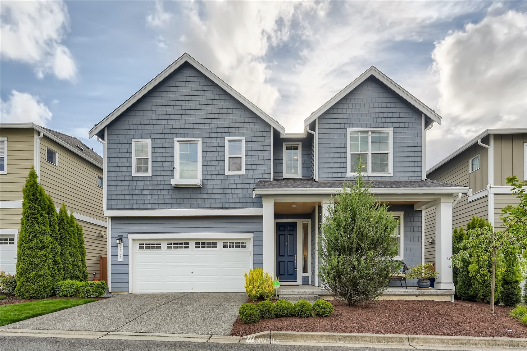 3532 198th Street Southeast Bothell, WA 98012 - Photo 1 of 39 a view of a house with a yard and plants