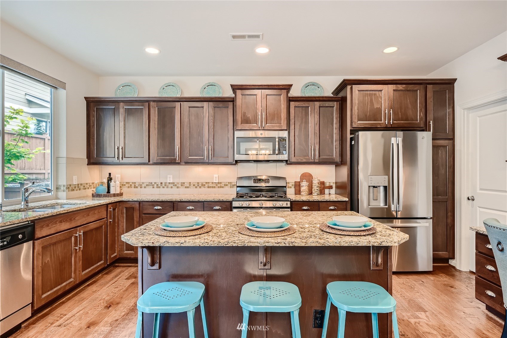 3532 198th Street Southeast Bothell, WA 98012 - Photo 13 of 39 a kitchen with cabinets and wooden floor