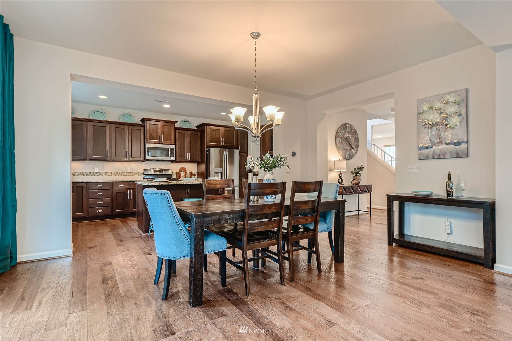 3532 198th Street Southeast Bothell, WA 98012 - Photo 17 of 39 a view of a dining room with furniture and wooden floor