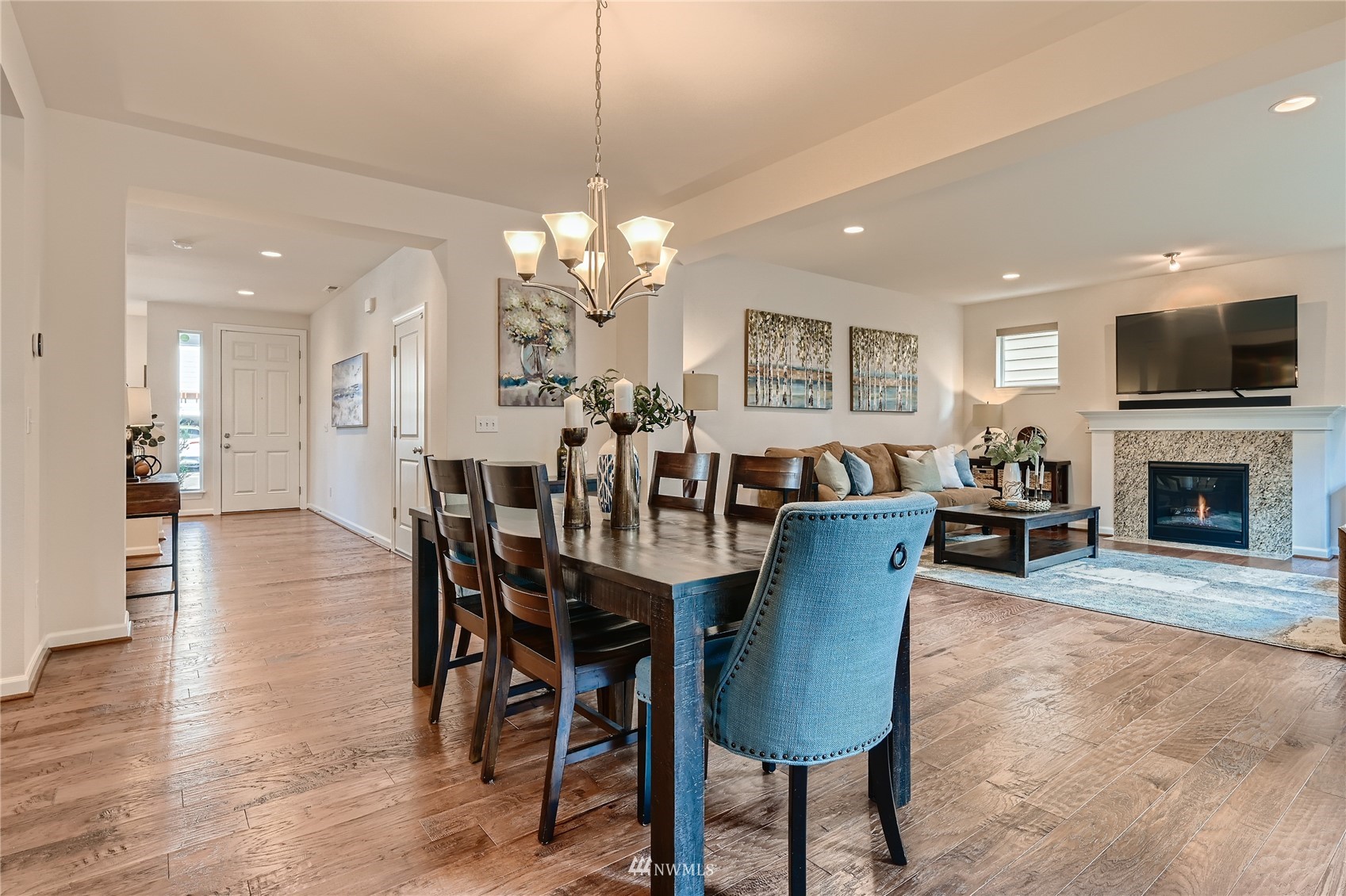 3532 198th Street Southeast Bothell, WA 98012 - Photo 19 of 39 a view of a dining room with furniture wooden floor and chandelier