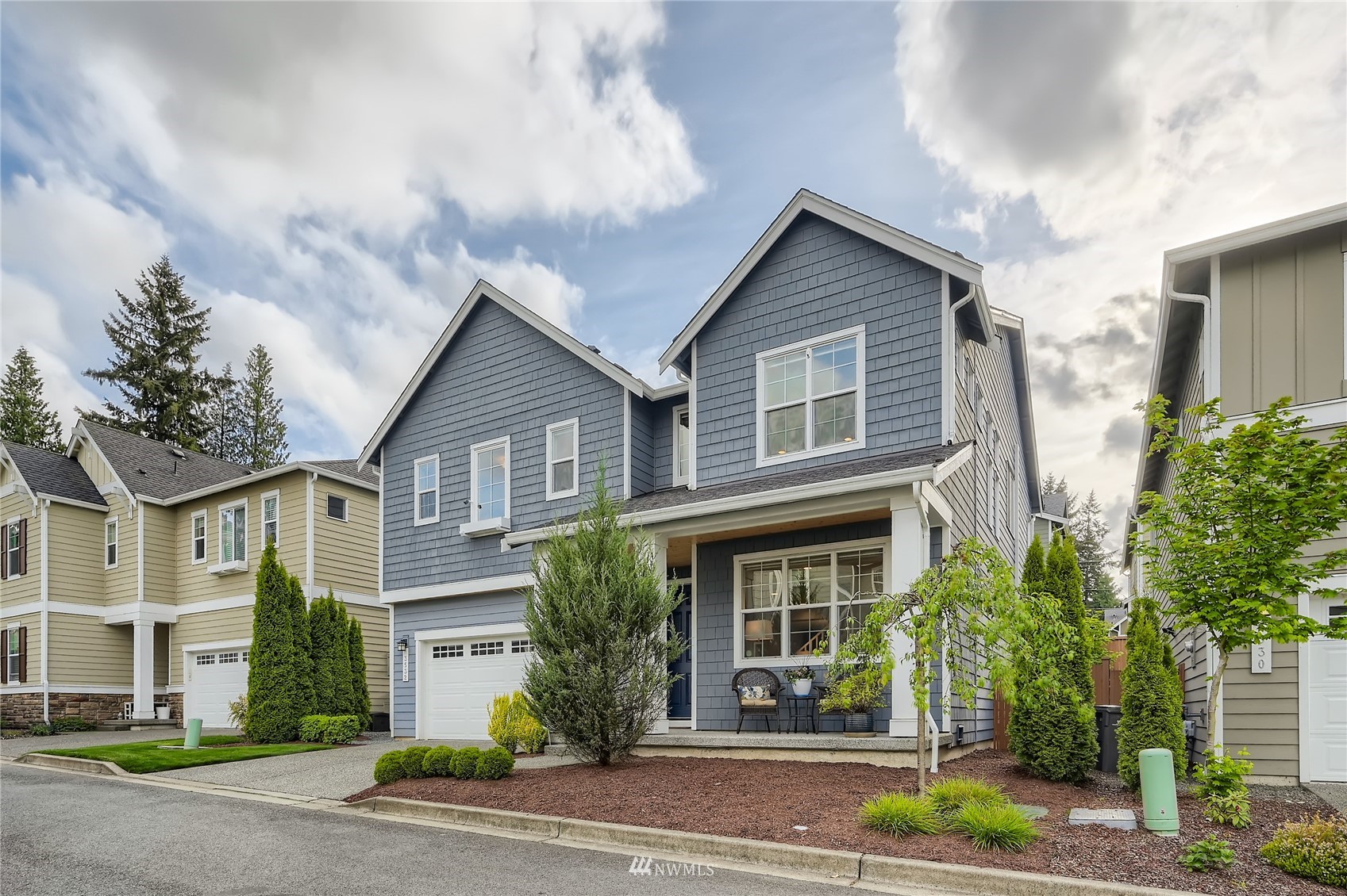 3532 198th Street Southeast Bothell, WA 98012 - Photo 2 of 39 a front view of a house with a yard and potted plants