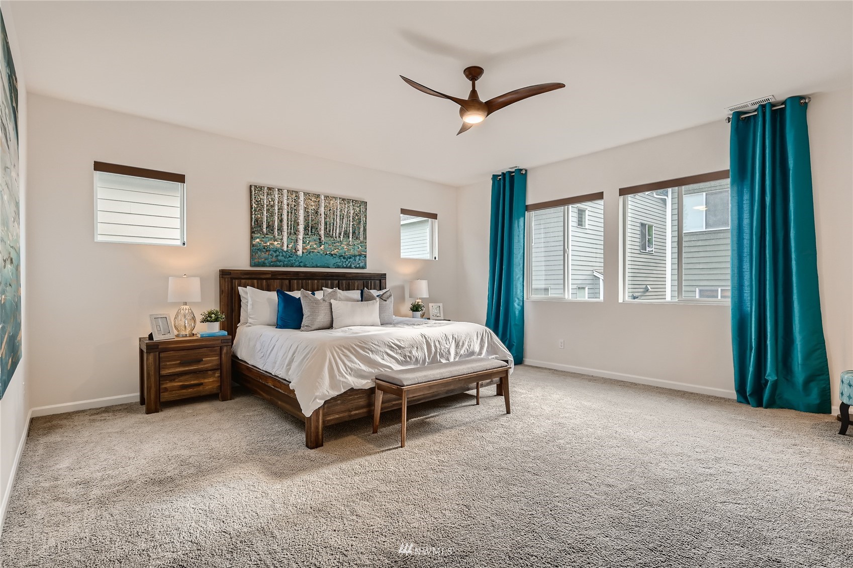 3532 198th Street Southeast Bothell, WA 98012 - Photo 22 of 39 a bed sitting in a bedroom next to a window
