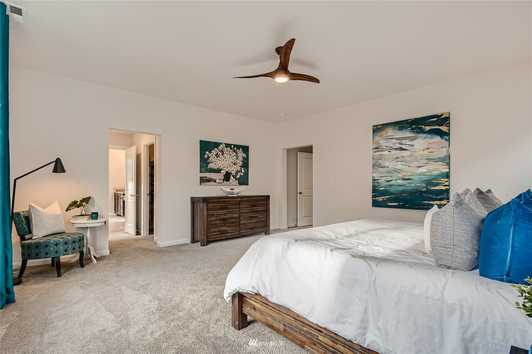 3532 198th Street Southeast Bothell, WA 98012 - Photo 23 of 39 a bedroom with a bed and a chandelier