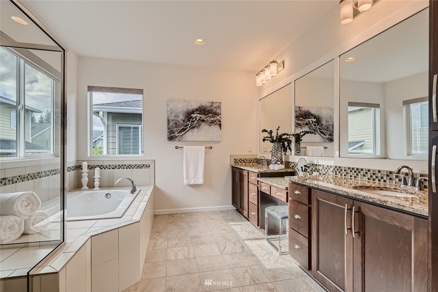 3532 198th Street Southeast Bothell, WA 98012 - Photo 25 of 39 a large bathroom with a sink a vanity a mirror and a bathtub