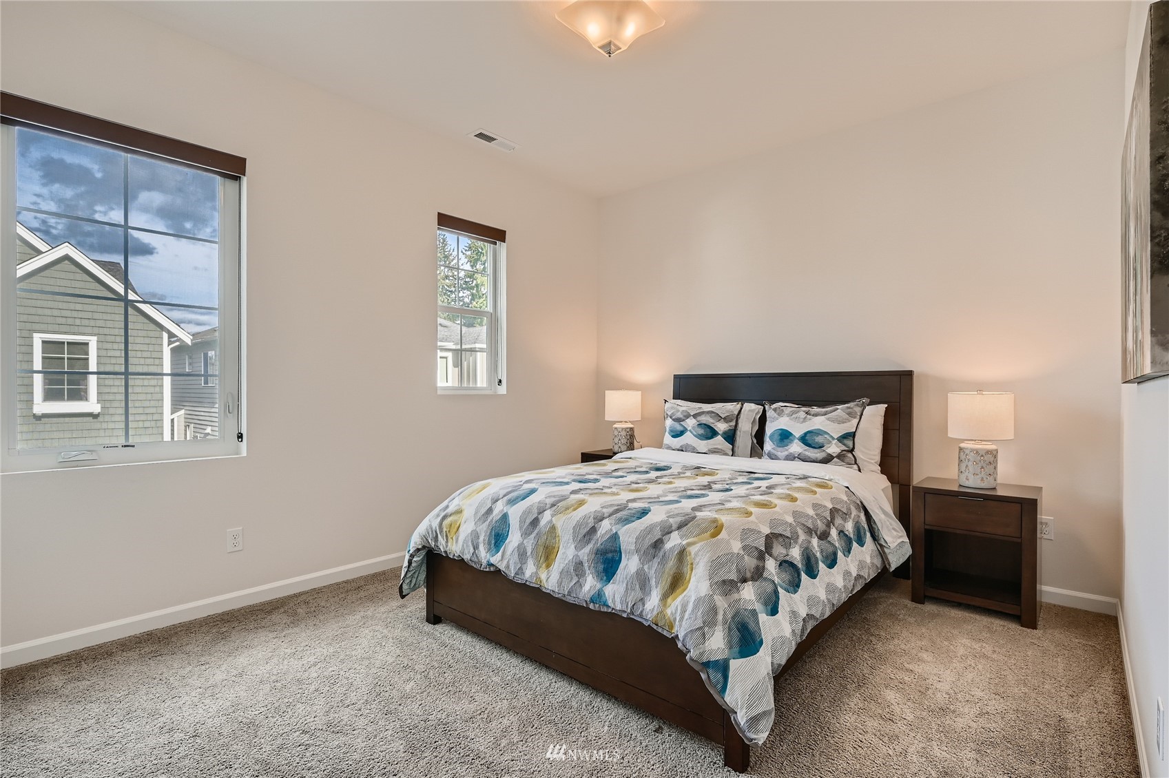 3532 198th Street Southeast Bothell, WA 98012 - Photo 27 of 39 a bed sitting in a bedroom next to a window