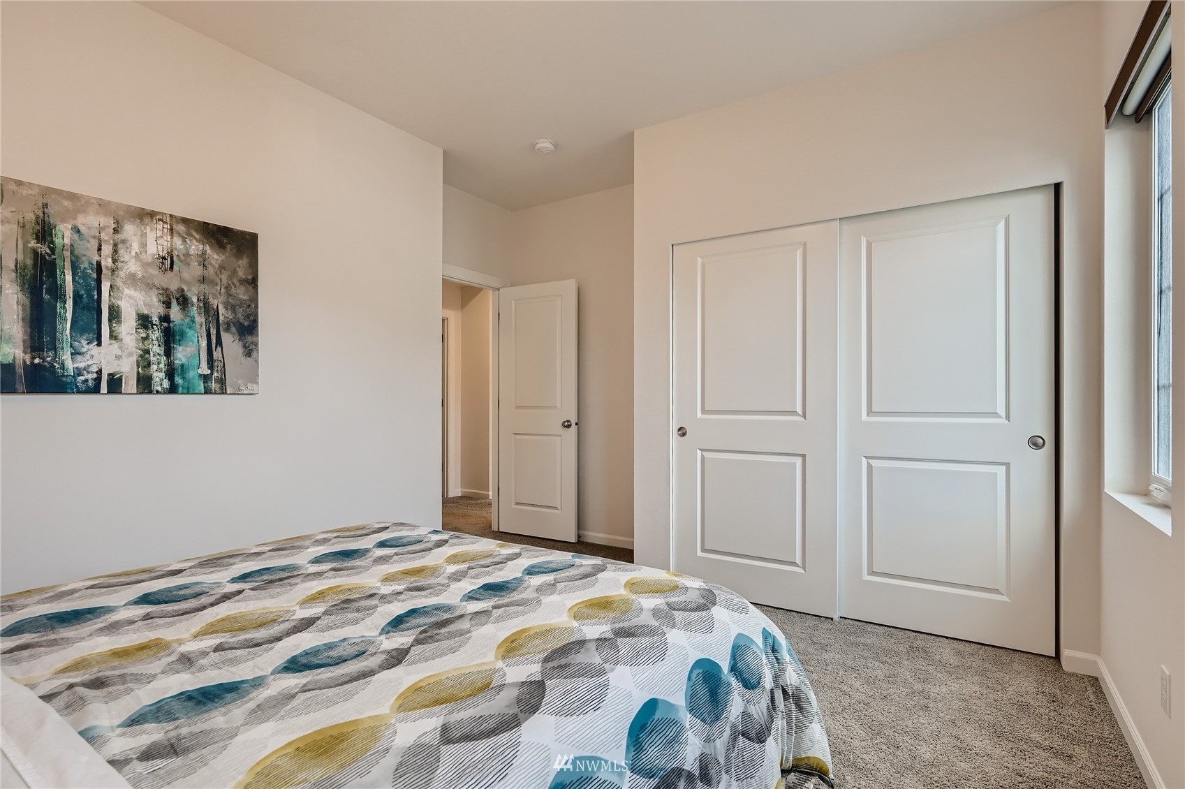 3532 198th Street Southeast Bothell, WA 98012 - Photo 28 of 39 a bedroom with a bed and a painting on the wall