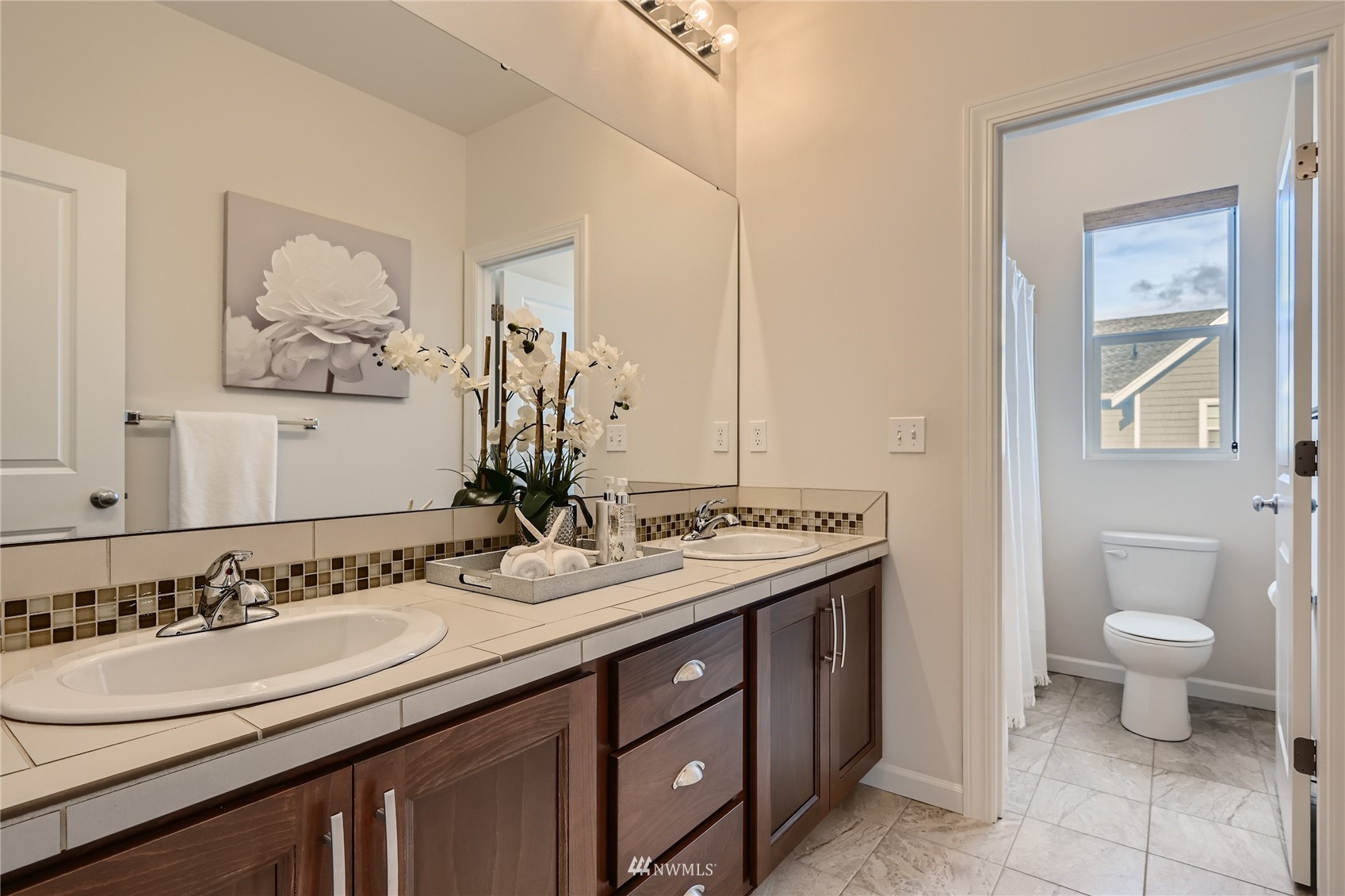 3532 198th Street Southeast Bothell, WA 98012 - Photo 30 of 39 a bathroom with a double vanity sink and a mirror