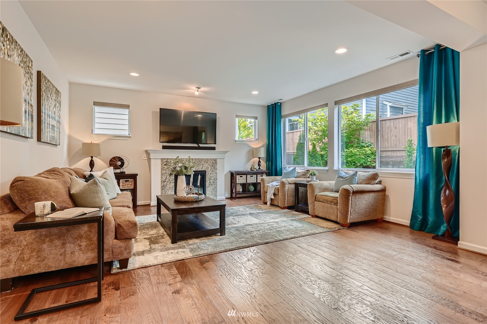 3532 198th Street Southeast Bothell, WA 98012 - Photo 5 of 39 a living room with furniture and a flat screen tv