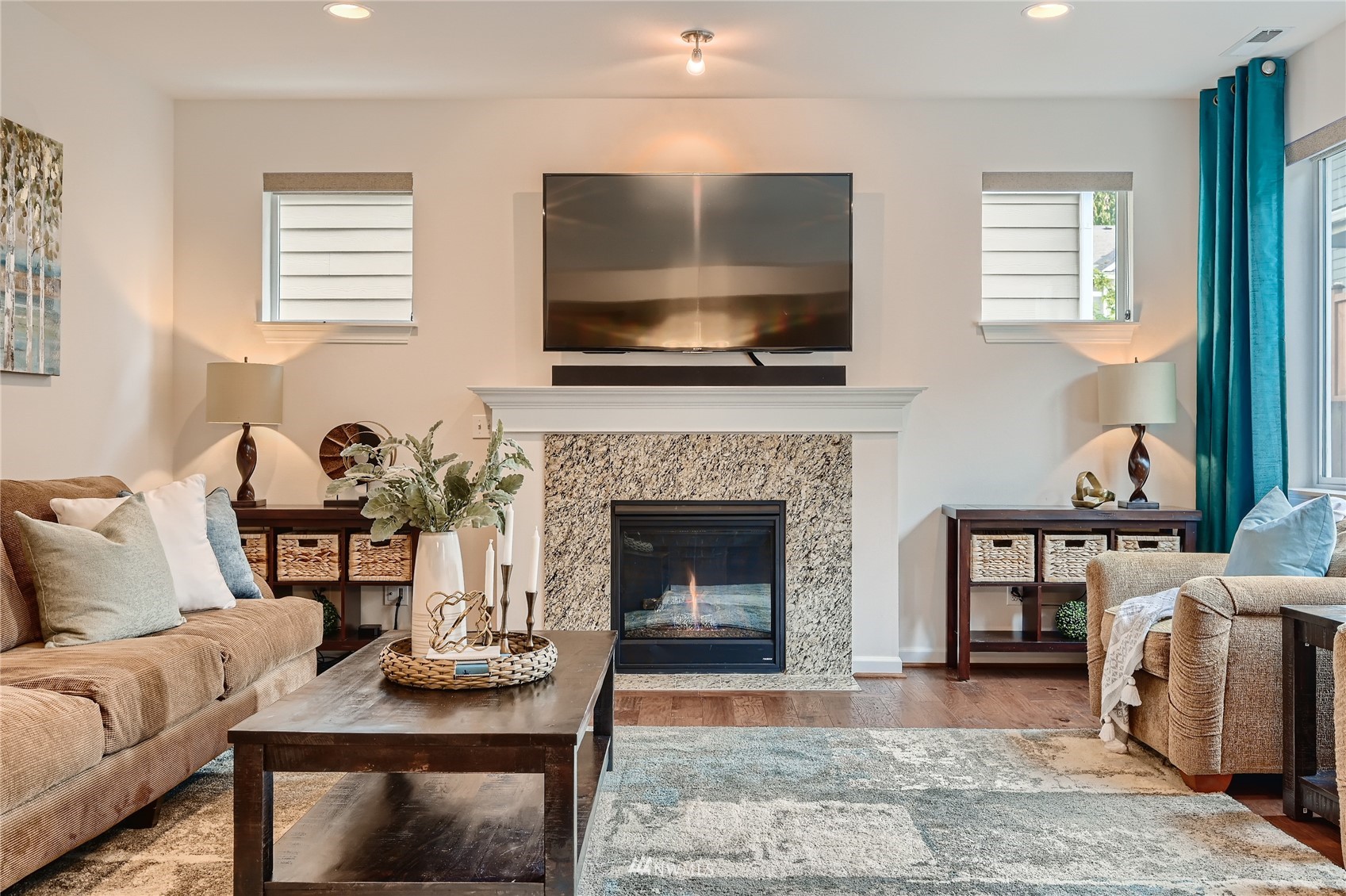 3532 198th Street Southeast Bothell, WA 98012 - Photo 7 of 39 a living room with furniture a flat screen tv and a fireplace