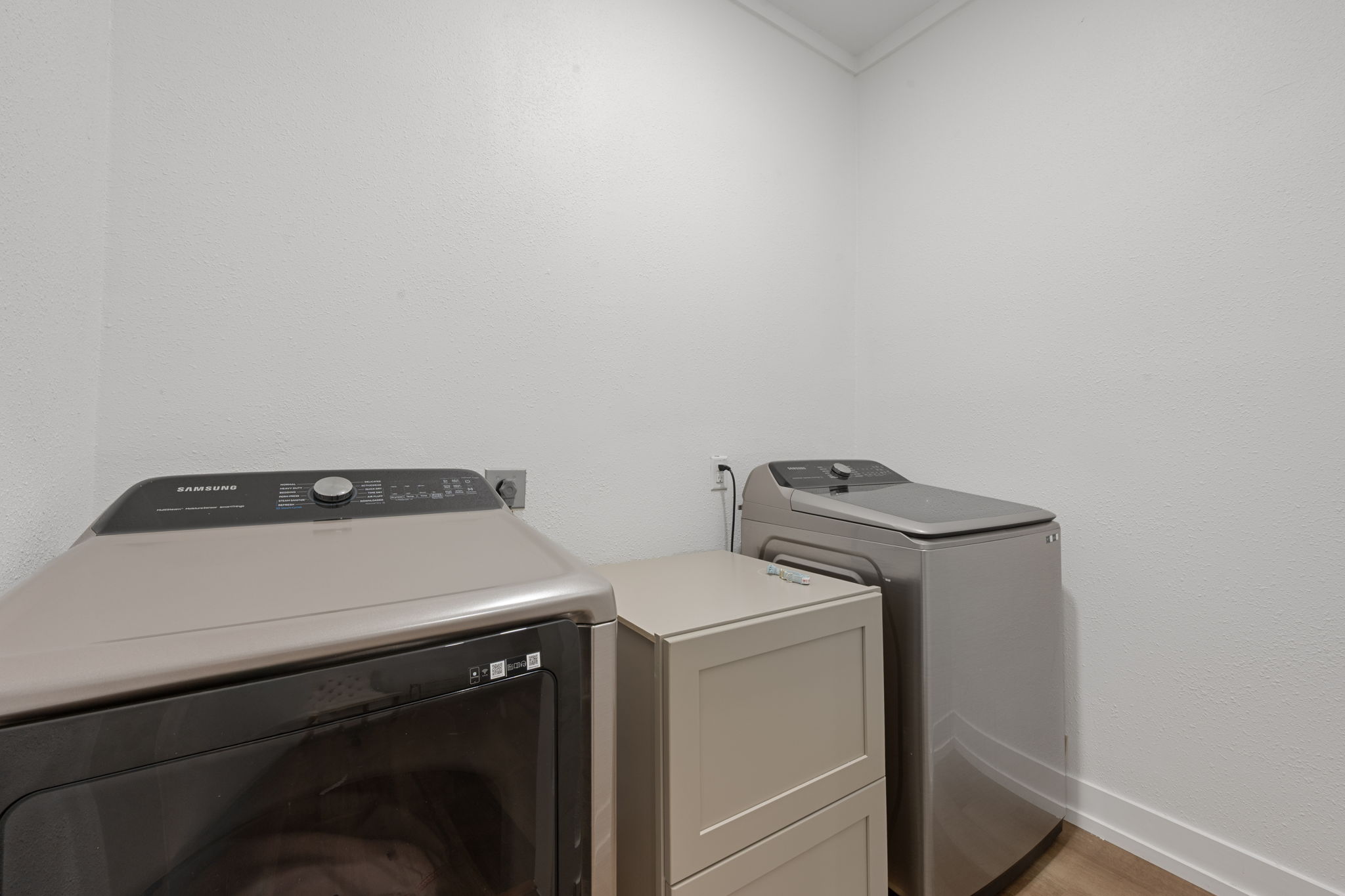 602 East 6th Street Cameron, TX 76520 - Photo 25 of 40 Dedicated laundry area with white walls and crown molding