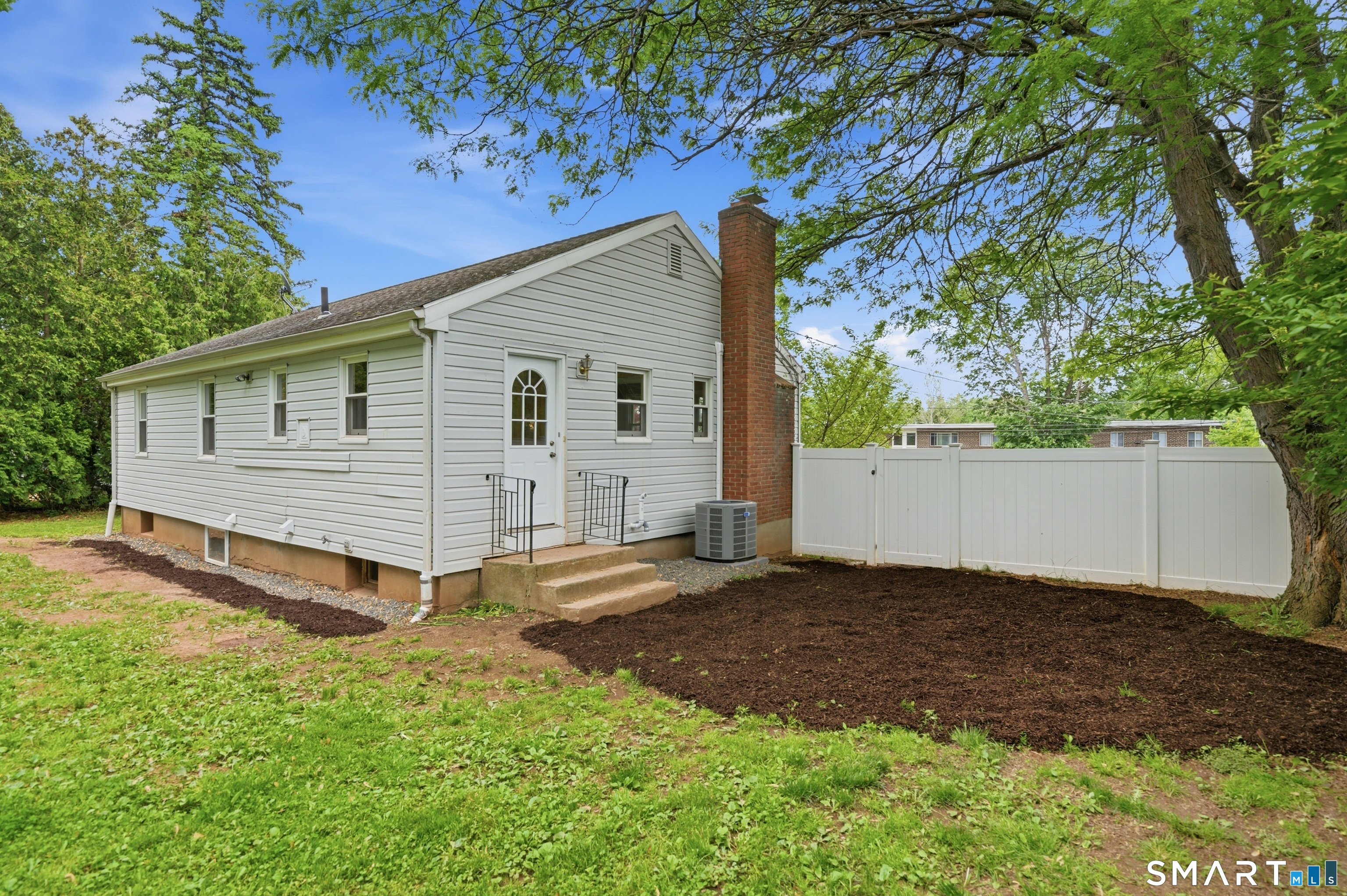 149 Mill Street Wethersfield, CT 06109 - Photo 24 of 29 a view of a house with a yard
