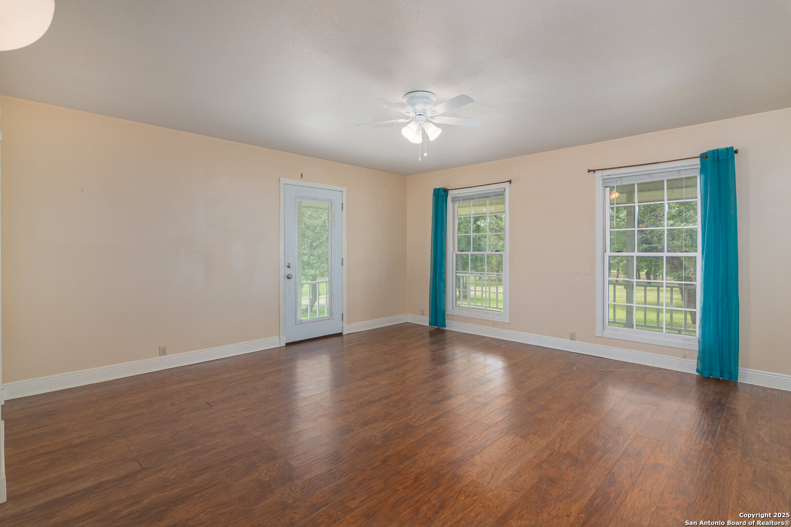 2981 Vivroux Ranch Road Seguin, TX 78155 - Photo 20 of 50 a view of an empty room with wooden floor and a window
