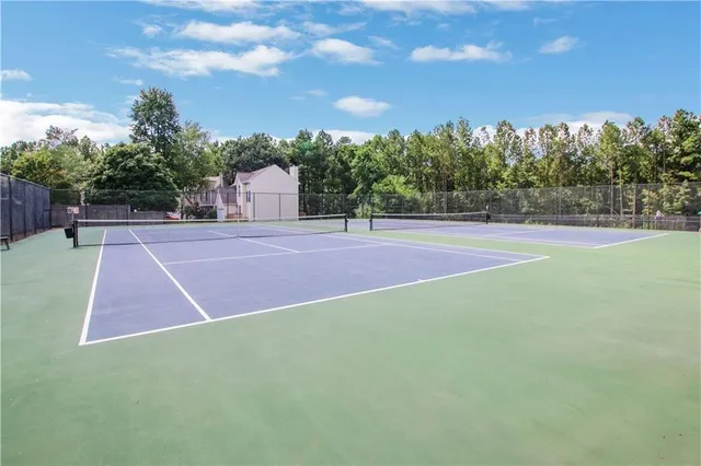 a view of outdoor space and tennis court