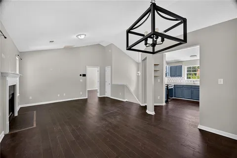 a view of an entryway with wooden floor
