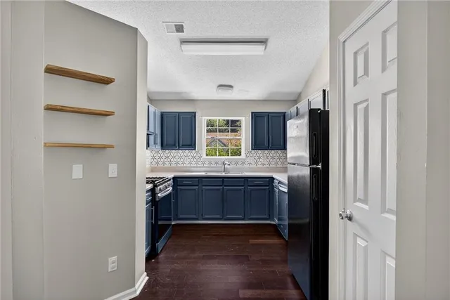 a large bathroom with a granite countertop sink and a mirror