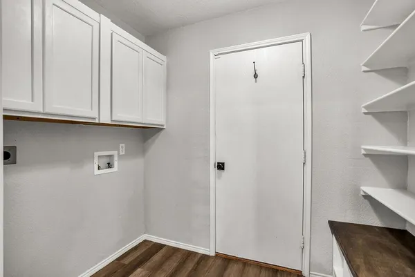 a view of cabinets with wooden floor