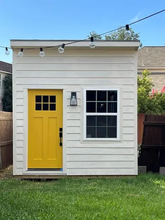 a view of front of house with a yard