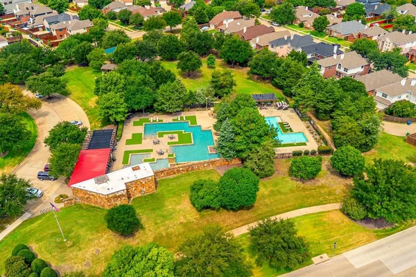 an aerial view of a garden with lawn chairs