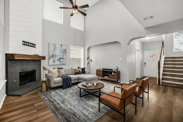 a living room with furniture and a fireplace