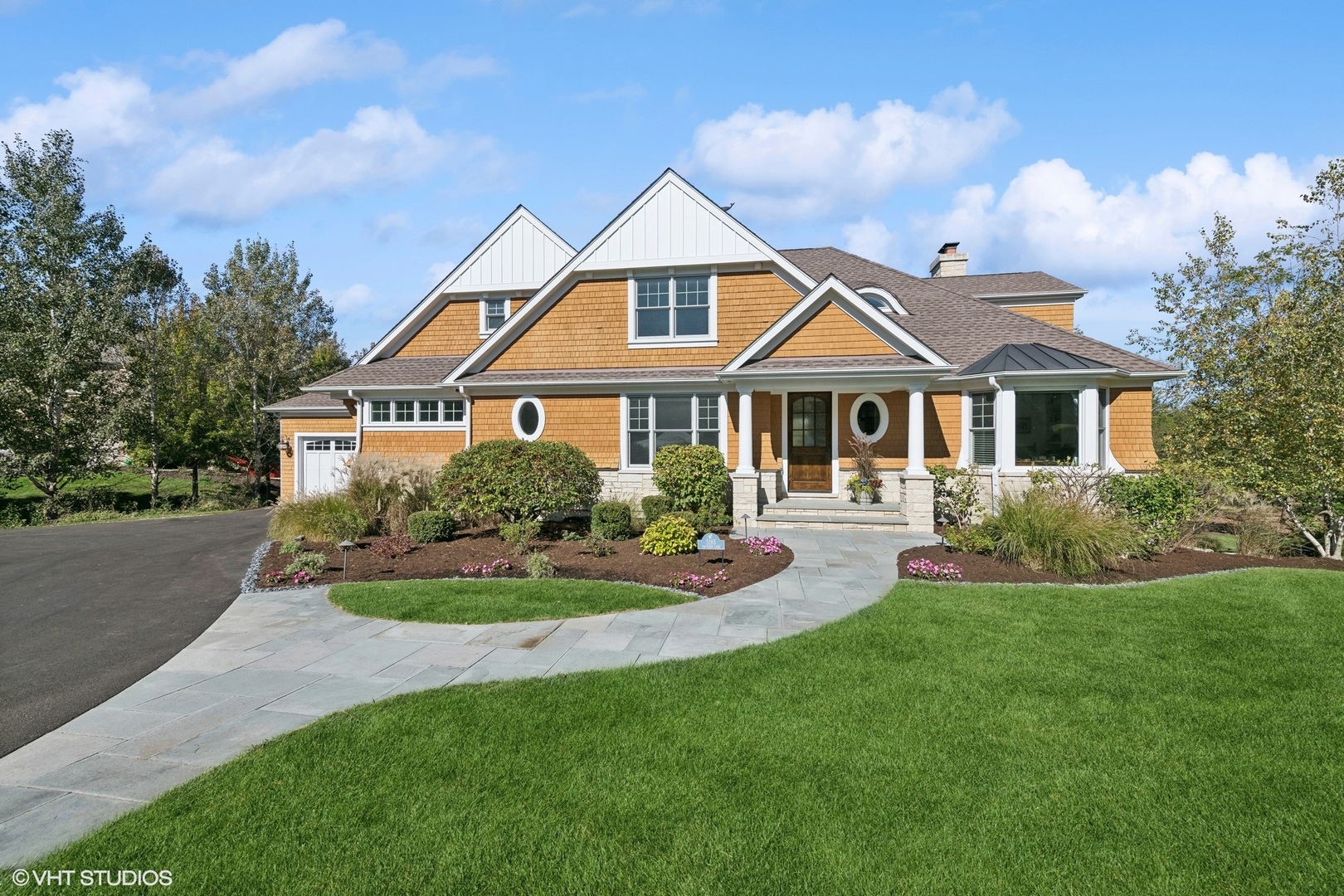 5185 Eastgate Lane Long Grove, IL 60047 - Photo 1 of 1 a front view of a house with a yard table and chairs
