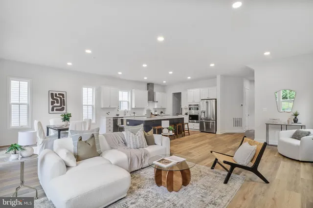 a living room with furniture and a table