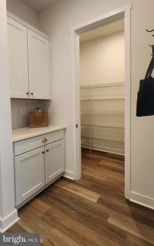 a view of cabinets and wooden floor