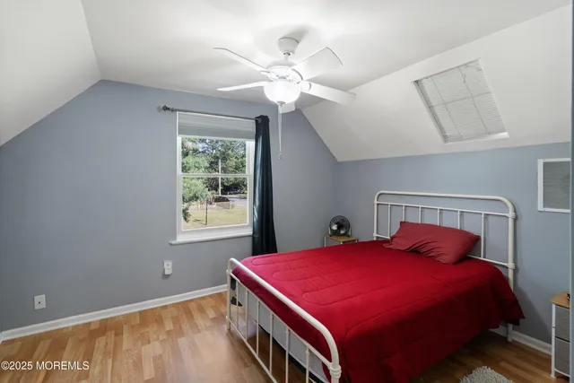 a bed room with a bed and a chandelier