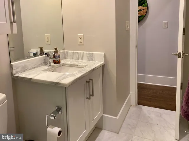 a bathroom with a sink and mirror