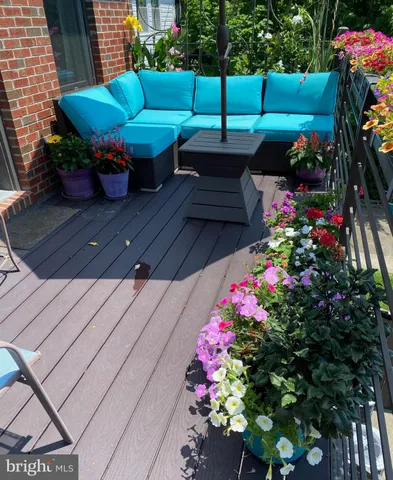 a view of a backyard with sitting area