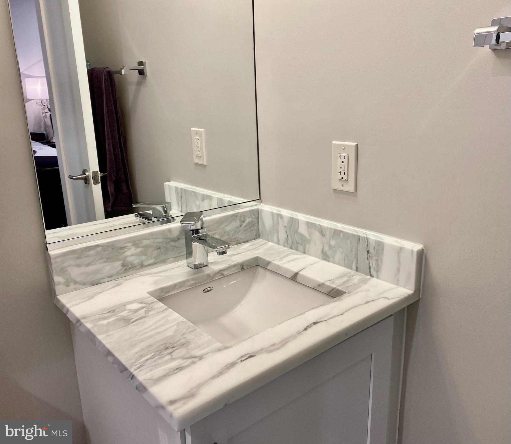 711 Jackson Street Northeast, Unit 3 Washington, DC 20017 - Photo 9 of 17 a close view of sink and tap